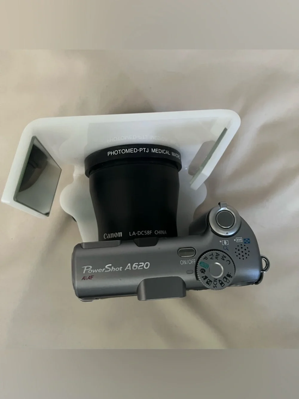 Canon PowerShot A620 digital camera with Photomed dental photography attachment
